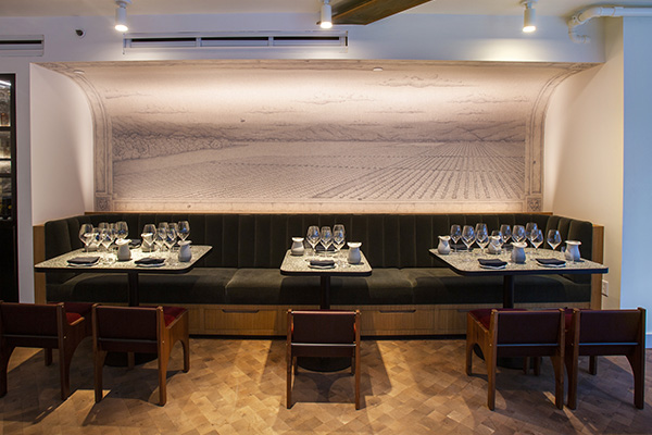 Urban tasting room mural and banquette seating