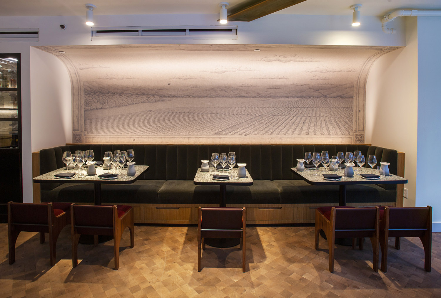 View of the urban tasting room with the mural and banquette seating